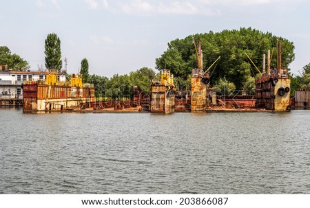 Odessa, Ukraine - July 8: river port of Ust-Danube. Older ships and river barges cut into scrap metal, repair docks empty. The results of bad economic policy of Ukraine, July 8, 2014, Odessa, Ukraine