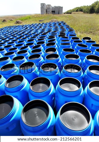 Blue plastic barrels for storing and transporting hazardous chemicals on the open stock poisonous toxic products in Odessa, Ukraine