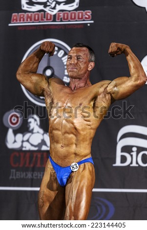 Odessa, Ukraine - October 12: Competitions Ukrainian bodybuilding bodybuilding athleticism of men and women by category on the stage, Ukraine October 12, 2014.