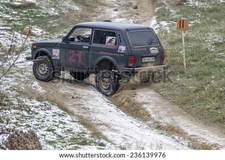 Odessa, Ukraine - December 6, 2014: Off-road 4x4 cars on the road passes sport routes in the winter mountains close-up, December 6, 2014 in Odessa, Ukraine.
