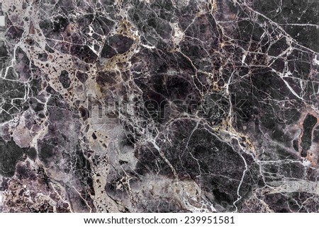 Brown natural marble . Beautiful multi-colored interior decorative stone marble abstract cracks and stains on the surface.
