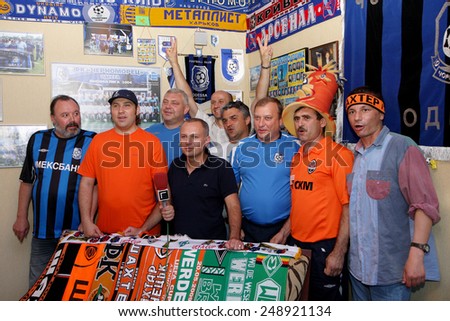 Odessa, Ukraine - May 31, 2009: Emotional happy soccer fans in his fan club celebrate the victory of their team. Attributes and symbols of football clubs in the football museum