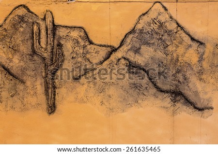 stone facade fresco wall decoration. Bas-relief image cowboy Indians and desert landscapes of America, Texas, with mountains and cactus