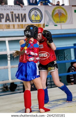 Odessa, Ukraine March 27, 2015: Ukrainian Cup on boxing among children. Muay Thai boxing. In the ring fighting girls boxers. Women\'s boxing.