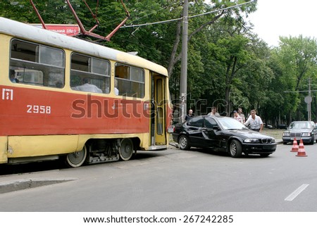 Odessa, Ukraine - June 13, 2008: an accident on the street. Streetcar rammed the car. Do not give way to the tram. Damaged expensive car in a collision with a tram.