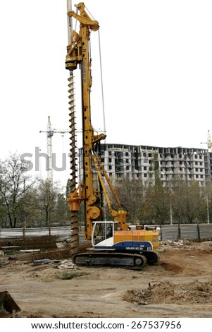 Odessa, Ukraine - November 3, 2008: Construction site. Research and setting the zero cycle, the foundation of a high-rise building. Construction rig for piling work and working in the trench