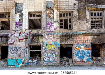 Graffiti artist illegally abandoned in a ruined building. Beautiful street art. Urban contemporary culture. In dark colors. selective Focus