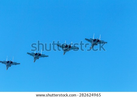 Sevastopol, Crimea, RUSSIA - May 9, 2015: Naval Aviation Russian Black Sea Fleet in the air. Military fighter. Military helicopters. Amphibious aircraft. Taken from below against the blue sky