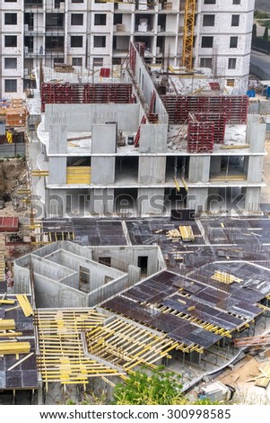 Odessa, Ukraine - May 5 2014: Construction of a group of apartment buildings in the various stages of construction. View from above. Cranes, zero cycle basement, ancillary works