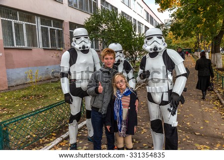 Odessa, Ukraine -25 October 2015: Darth Vader's stormtroopers just communicate with humans, photographed with children. Fictional characters Star Wars appeared in real life in  elections to  councils