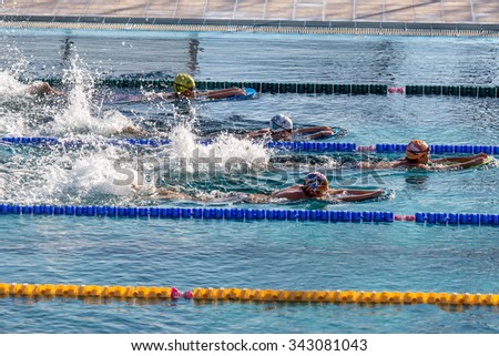 VARNA, BULGARIA - 21 November 2015: Sport swimming pool during training swimmers children. Go athletic training. Healthy lifestyle concept. Train swimmers entry-level training
