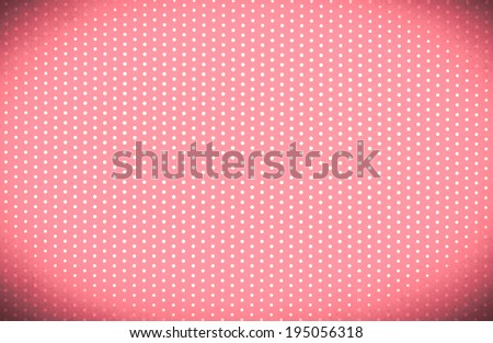 Polka dots on a red background with bright center and dark vignette border.