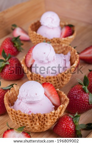 Fresh strawberry ice cream in waffle bowls