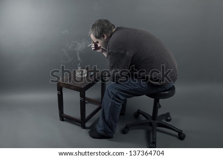 A young caucasian man is alone, stressed, got fired from work is unemployed and sad.