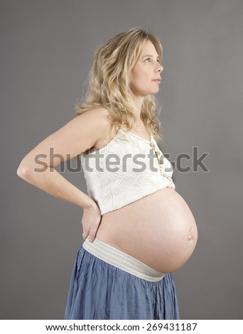 a young blonde woman shortly before the birth of her child