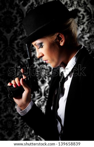 woman holding a gun to her head