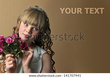 A curly hair girl with bouquet flowers and a diadem \