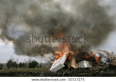 illegal burn refuse, poisonous smoke of polystyrene foam, fire and fumes, clouds of toxic smoke