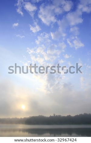mystical landscape over haze lake, cloud over beautiful dawn, small hours of the morning