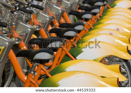 A row of public bicycles.  These bikes are part of the public transport system in Taipei, Taiwan. This helps to reduce traffic and keep the city greener.
