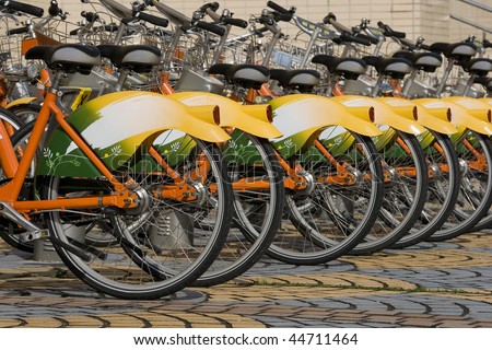 A row of public bicycles.  These bikes are part of the public transport system in Taipei, Taiwan. They help made Taipei Greener.