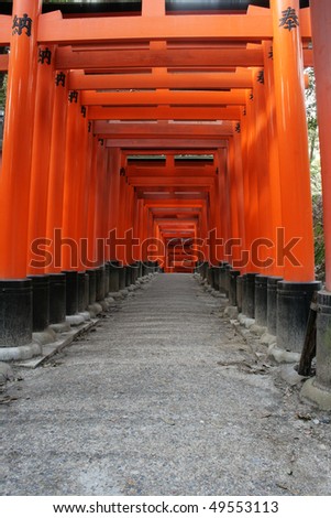 These are Torii gates at Fushimi-inari Shrine, Kyoto, Japan.  These gates line the hill sides that lead up to the main Shinto shrines at the top of the hill.