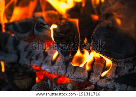 Fire wood coal amber ash closeup