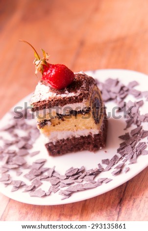 poppy seed cake with forest berries decorated on a white plate