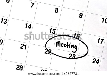 the word meeting has been written on a day of a monthly calendar, in bold, black, permanent marker.