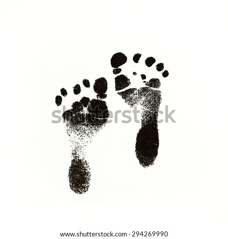 a photo of newborn baby footprints made with black in on white square paper