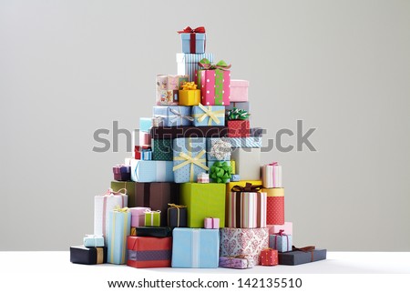 Group of presents. Gift boxes with origami bows. grey background.
