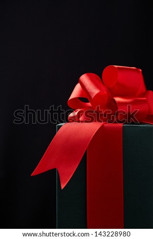 gift box on black background. Gift box with origami bows.