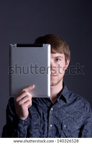 handsome man covers half the face tablet