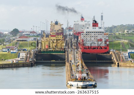 Two large ships wait to transit the Miraflores locks in the Panama Canal, just outside Panama City.