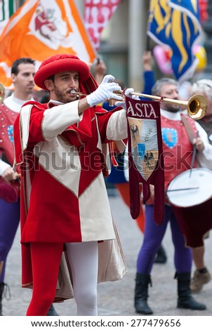 Asti, Italy - September 19, 2010: the historic Medieval parade of the Palio of Asti in Piedmont, Italy. Reenactment in medieval costumes, Trumpeter