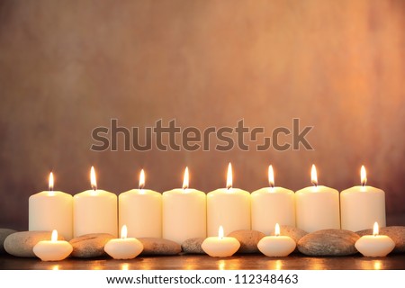 Zen stones and aromatic candles on table,Zen concept.