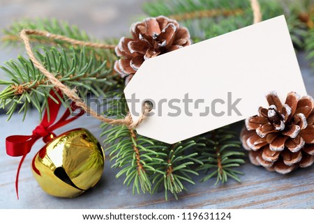 Christmas ornaments with label on wooden background