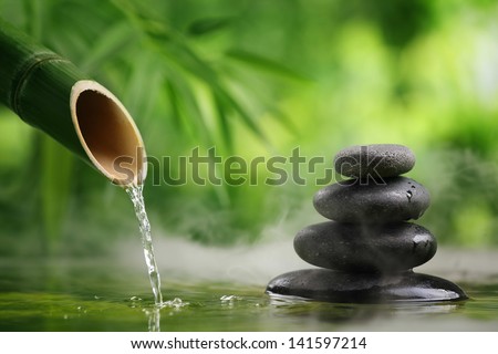 Spa still life with bamboo fountain and zen stone