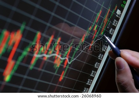 pen showing financial chart on screen