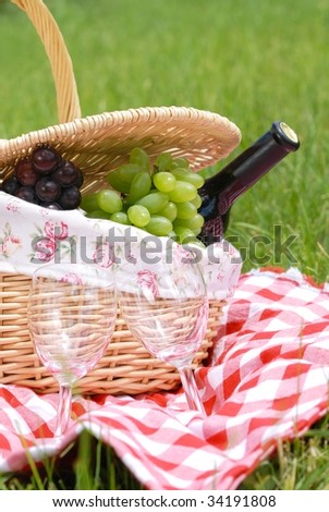 picnic setting with wine and grapes