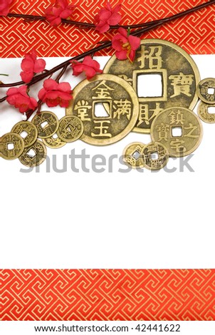 Ancient chinese copper coin with plum blossom on white background. copy space leaves for your text.