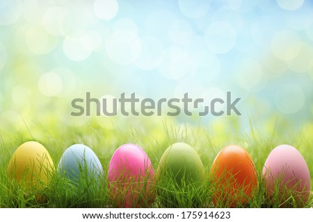 Row of Easter eggs in Fresh Green Grass