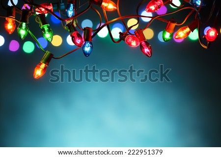 Christmas lights over dark blue background