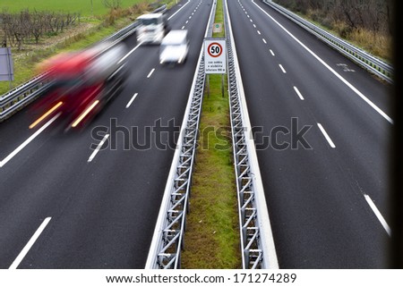 traffic on the freeway with cars and trucks overtaking