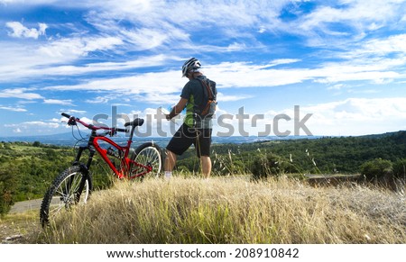 man on mountain bike read the map
