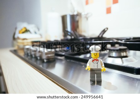 Orvieto, Italy - February 3th 2015: Lego chef mini figure on kitchen. Lego is a popular line of construction toys manufactured by the Lego Group