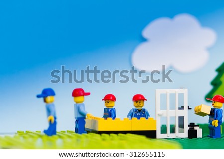 Orvieto, Italy - August 29th 2015: Construction site of Lego, Team of workmen build a house in a sunny day. Lego is a popular line of construction toys manufactured by the Lego Group