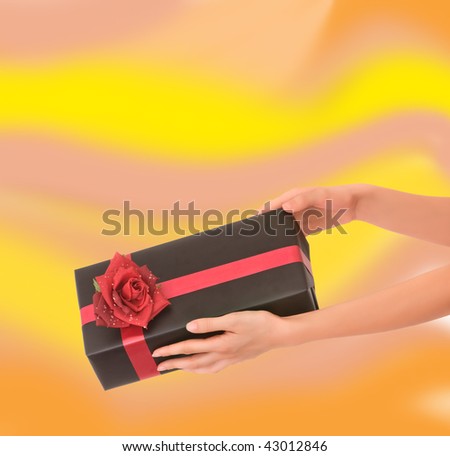 woman giving a present in the black box with red rose