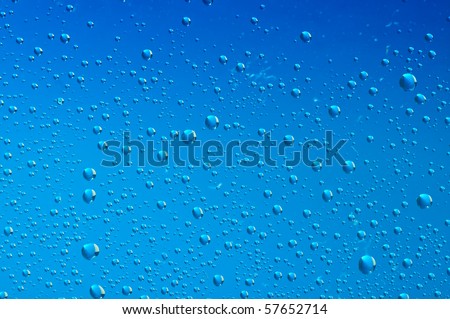 blue water bubbles on the window for background