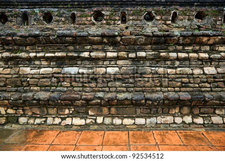 An ancient stone wall of Buddhist temple
